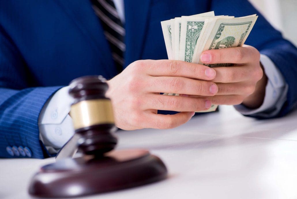 Lawyer distributes money awarded in a personal injury settlement in Florida