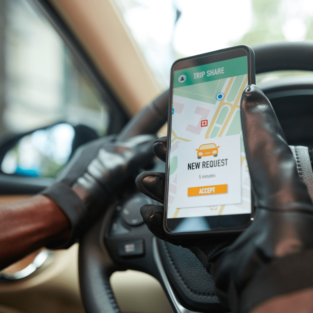 man looking at his phone while driving
